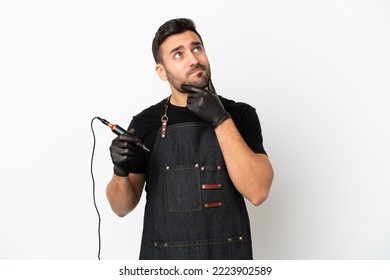 Tattoo Artist Man Isolated On White Background Having Doubts