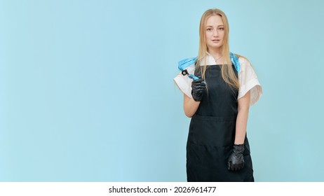 The Tattoo Artist Poses Standing With A Tool In His Hands Against The Background Of A Blue Wall With A Place To Copy The Text.