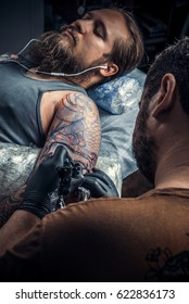 Tattoo Artist Working Tattooing In Tattoo Parlour