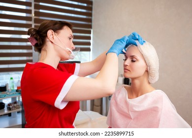 Tattoo Make-up Artist Beautician Preparing Facial Markings Using White Cotton Pads for Professional Eyebrow Permanent Makeup in Salon. Horizontal Image Orientation - Shutterstock ID 2235899715