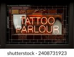 Tattoo parlour parlor logo in neon signs