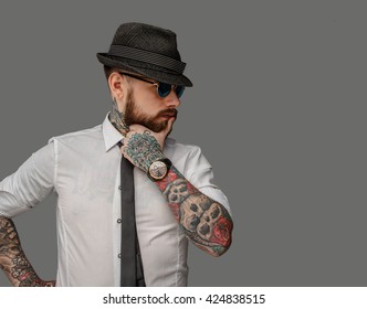 Tattooed Bearded Man In White Shirt Isolated On Grey Background.