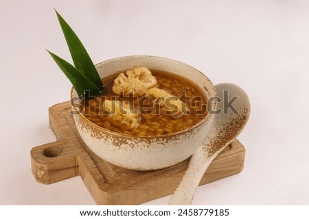 Tau Suan is Split Mung Bean Soup, Topped with You Tiao.