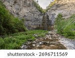 Taughannock Falls drops through a dramatic gorge surrounded by cliffs and forest in the Finger Lakes region of New York