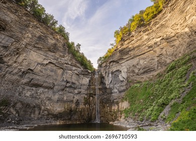 Taughannock Falls drops through a dramatic gorge surrounded by cliffs and forest in the Finger Lakes region of New York