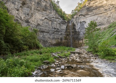 Taughannock Falls drops through a dramatic gorge surrounded by cliffs and forest in the Finger Lakes region of New York
