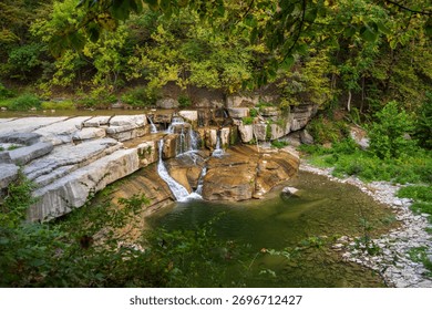 Taughannock Falls drops through a dramatic gorge surrounded by cliffs and forest in the Finger Lakes region of New York