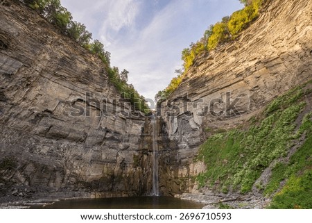 Taughannock Falls drops through a dramatic gorge surrounded by cliffs and forest in the Finger Lakes region of New York