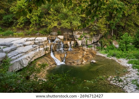 Taughannock Falls drops through a dramatic gorge surrounded by cliffs and forest in the Finger Lakes region of New York