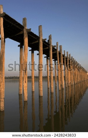 Taungthaman lake, u bein's bridge, the longest teak span bridge in the world, originally supported by 984 teak posts, amarapura, mandalay, myanmar (burma), asia