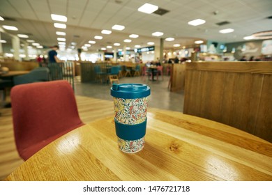 TAUNTON, DEVON, UK - AUGUST 12TH 2019; Close Up Of Reusable Bamboo Coffee Cup On The Interior Of Motorway Service Station