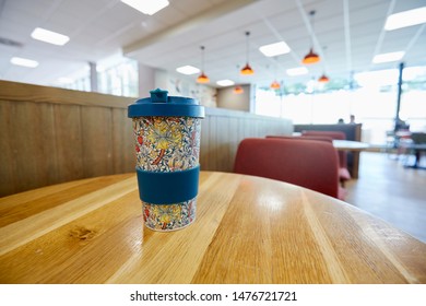 TAUNTON, DEVON, UK - AUGUST 12TH 2019; Close Up Of Reusable Bamboo Coffee Cup On The Interior Of Motorway Service Station