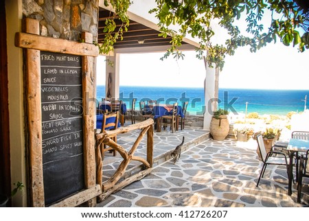 A Taverna in Ios, Greece with the chalk menu-board outside.
