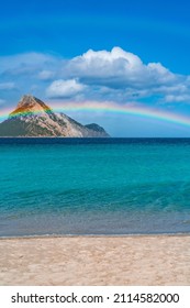 Tavolara Island, Scenic View Of Island And Full Rainbow In A Unique Moment