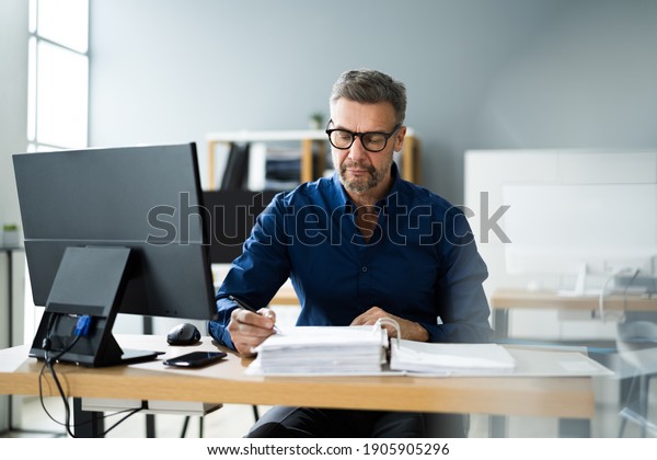 Tax\
Accountant Advisor Man Doing Sales Invoice\
Accounting