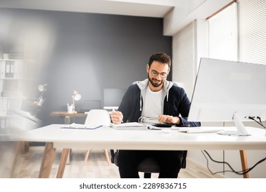Tax Accountant Advisor Using Computer For Invoice Calculation