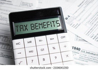 TAX benefits word on calculator. Business and tax concept. Time to pay tax in year. - Shutterstock ID 2104041350
