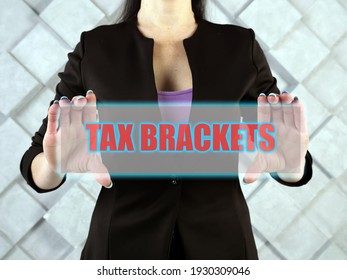  TAX BRACKETS Text In Futuristic Screen.  Tax BracketsÂ show You TheÂ taxÂ rate You Will Pay On Each Portion Of Your Income.
