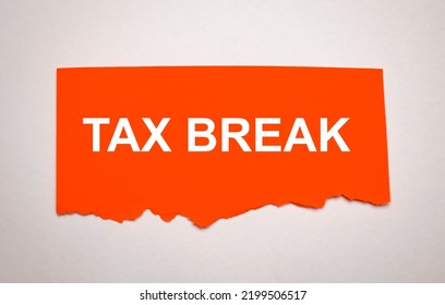 Tax Break On Torn Paper And White Background