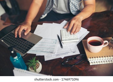 Tax Budget Plan Concept. Annual Tax Form For Individual Income Under US Law At Home Office Desk. Season To Pay Tax, Accountant Calculate Refund Tax And Using Computer To Work Online And Report Data