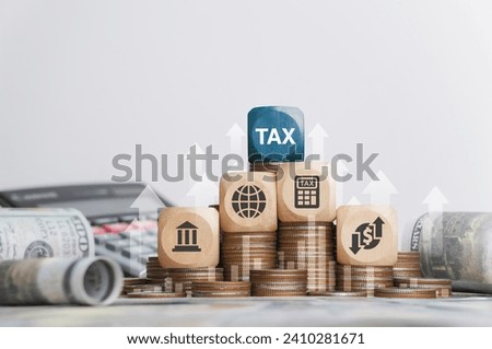 Tax concept with icons on wooden blocks Tax reduction planning, expenses, accounting, VAT and property taxes. Request a tax refund and submit taxes for online tax documents to the government.