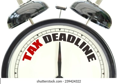 Tax Deadline Alarm Clock Over A White Background