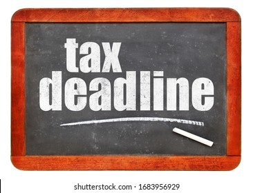 Tax Deadline White Chalk Text On A Vintage Slate Blackboard, Extended Deadline For 2020 Due To Coronavirus Pandemic