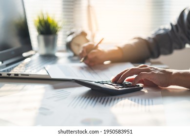 Tax deduction planning concept. Businessman calculating business balance prepare tax reduction. - Shutterstock ID 1950583951
