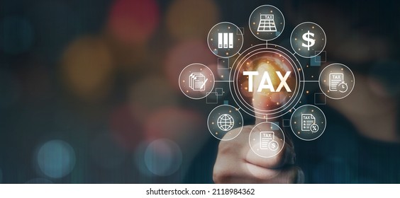 Tax deduction planning concept, expenses, accounting, value added tax, income tax and property tax. Paying taxes. Hands of businessman in dark with technology light. - Shutterstock ID 2118984362