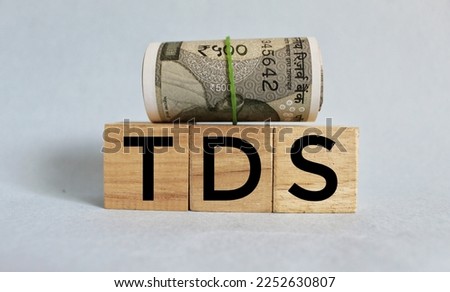 Tax Deduction at Source concept, TDS concept on wooden blocks. 