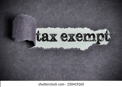 tax exempt word under torn black sugar paper 
