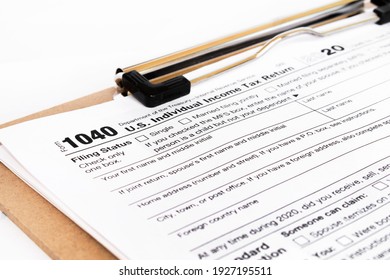 Tax form 1040 for tax year 2012 for US individual tax return with pen - Shutterstock ID 1927195511