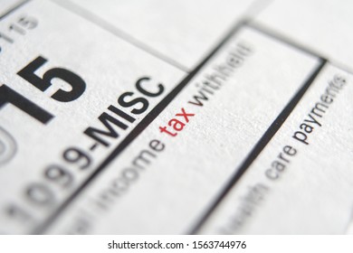 Tax form business financial concept with Close-Up TAX on red - Shutterstock ID 1563744976