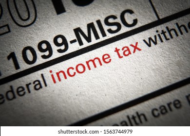 Tax form business financial concept with Close-Up INCOME TAX on red - Shutterstock ID 1563744979