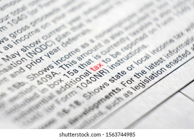 Tax form business financial concept with Close-Up TAX on red - Shutterstock ID 1563744985
