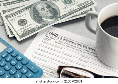 Tax Form, Calculator, Eyeglasses And Money On Desk. Tax Time Concept