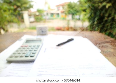 Tax Form With Money, Pen, Calculator And Clock, Abstract Blur Background