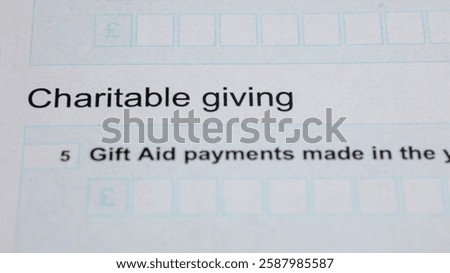 Tax form section on charitable giving and gift aid payments with entry fields. Financial information. Document with empty fields for input data.