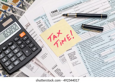 Tax Form With Sticker Calculator, Money And Pen Business Concept