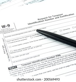 Tax form W-9 and pen