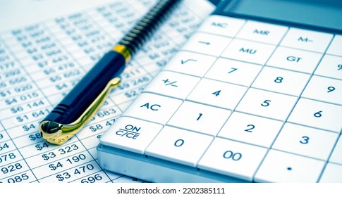 Tax Forms, Spread Sheet With Pen And Calculator.