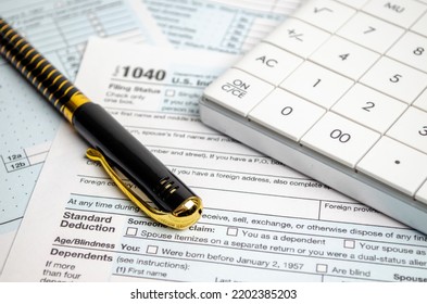 Tax Forms, Spread Sheet With Pen And Calculator.