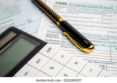 Tax Forms, Spread Sheet With Pen And Calculator.