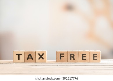 Tax free sign made of wood on a table
