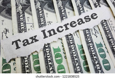 Tax Increase News Headline On Hundred Dollar Bills