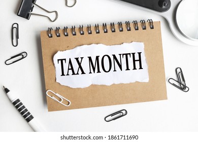 TAX MONTH, text on white paper on white background - Shutterstock ID 1861711690