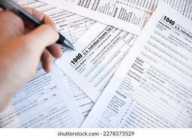 Tax paperwork for internal revenue service IRS showing financial accounting 1040 documents showing time for payment and deadline for refund time and declaration of financial debt and profit balance