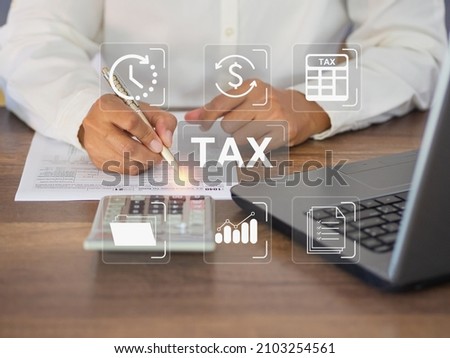 Tax payment and Calculation tax return concept. Businessman using a tax form to complete Individual income tax payment form. Taxes paid by individuals and corporations