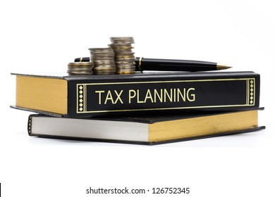Tax Planning Book With Coins And Pen Isolated On White