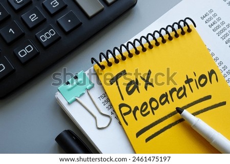 Tax preparation concept. Stack of papers and calculator.